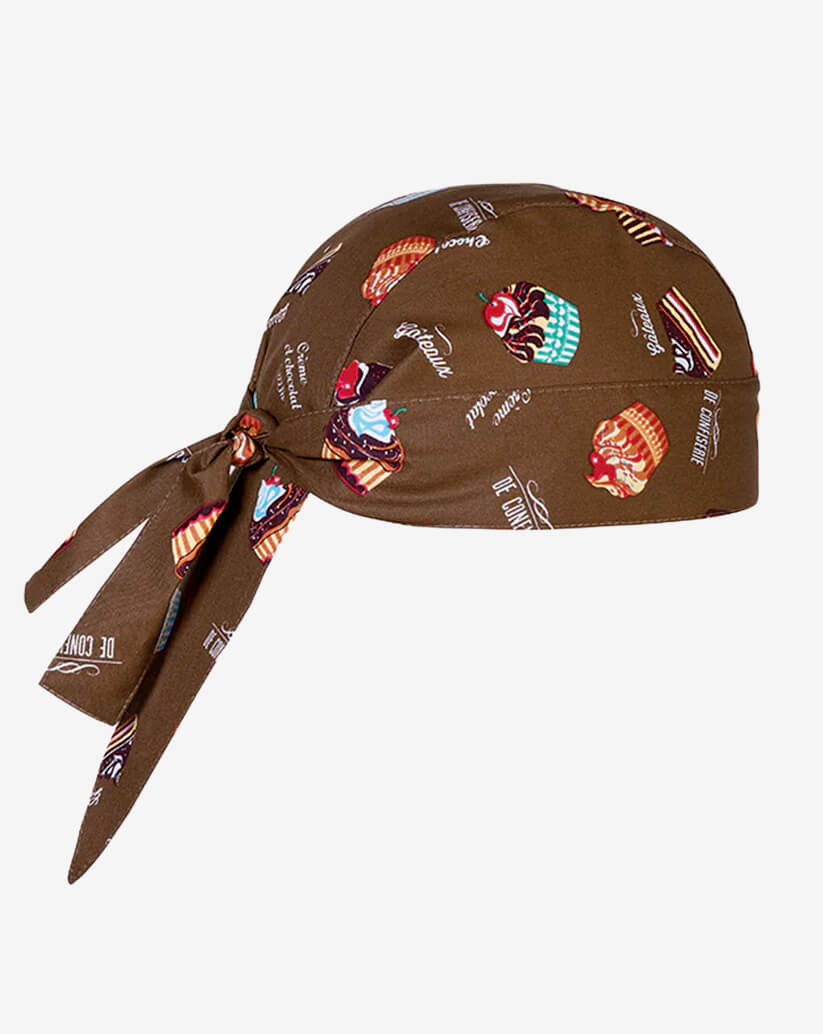Bandana da cucina in cotone marrone con fantasia di cupcake e scritte pasticceria e lacci posteriori regolabili.