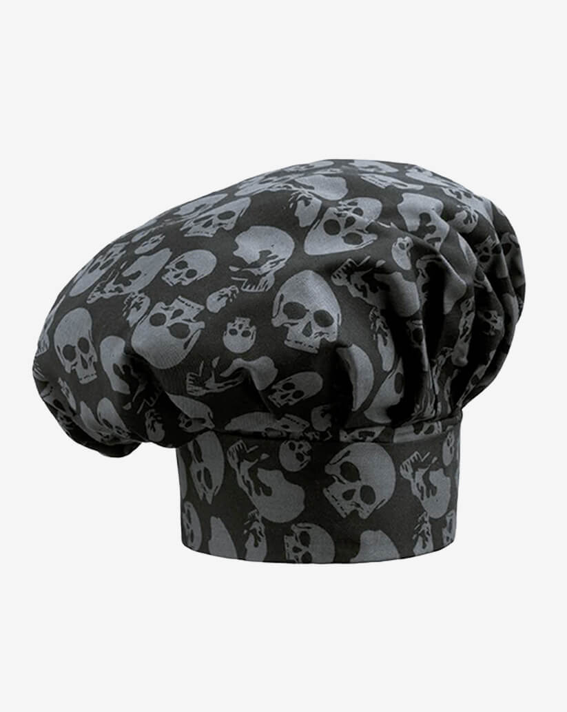 Cappello da cuoco nero in misto cotone con fantasia a teschi grigi sfumati, fascia piatta regolabile con velcro e parte superiore a sbuffo