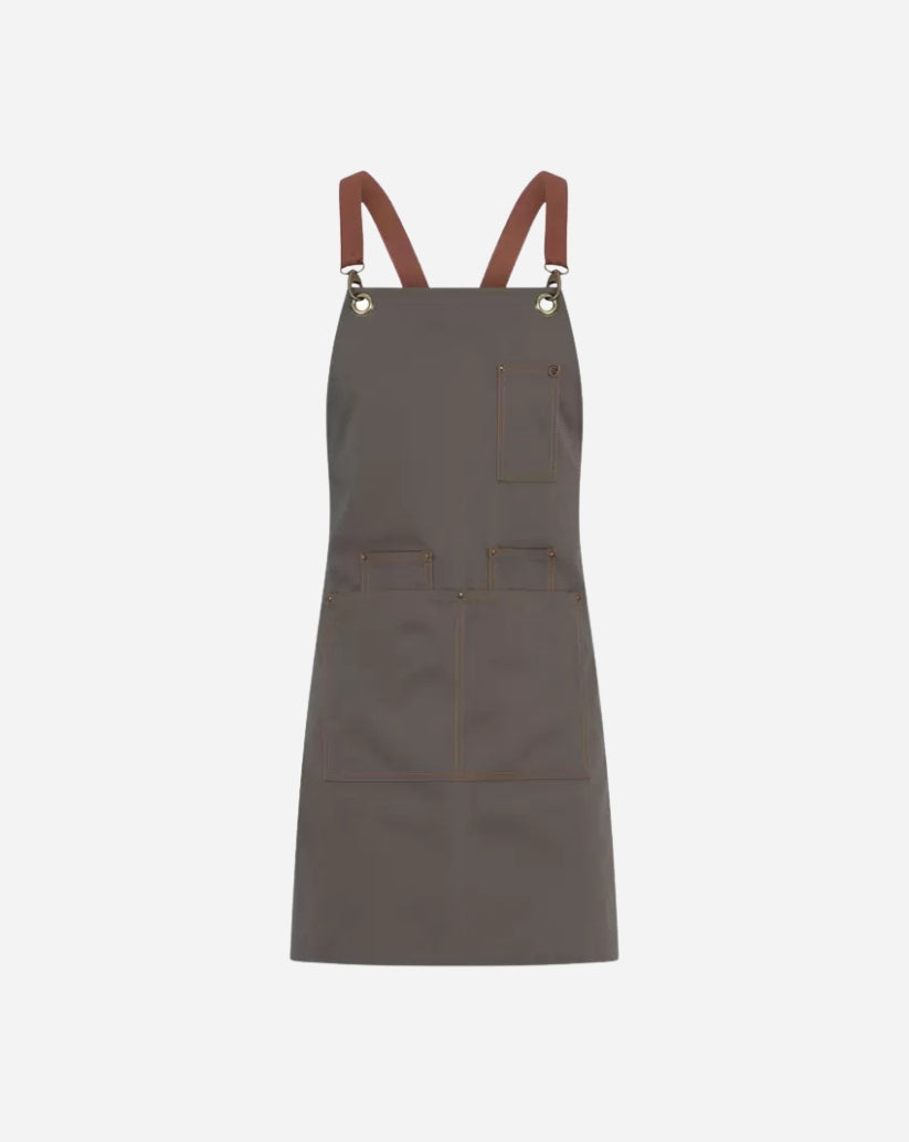 Grembiule unisex tortora in poliestere e cotone con bretelle staccabili,  tre portapenne, due tasche ampie e vele in ottone.